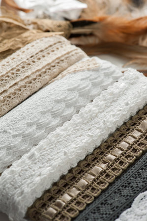 Close-up of white, beige laces. Handmade still life