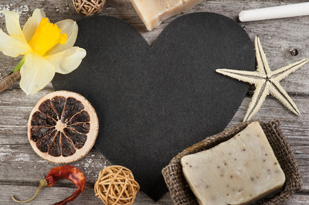 Spa background with chalk board, organic soap, weathered wooden tableの写真素材