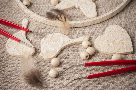 Closeup of red tools for DIY. Handmade workshop composition of beads, threads, toolsの写真素材