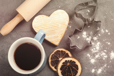 Baking set with tea, rolling pin, flour and star shape cookie cutter on concrete background. Toned imageの写真素材