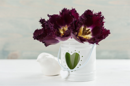 Provence still life. Bouquet of purple tulips, blue wooden background, wedding decorの写真素材