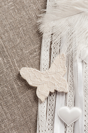 Linen background with wedding decoration. White butterfly. Wedding, xmas rough texture flat layの写真素材