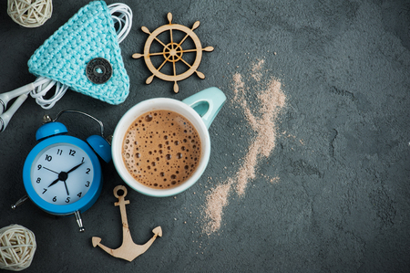 Breakfast concept, mug of hot chocolate or cocoa, alarm clock on concrete backgroundの写真素材