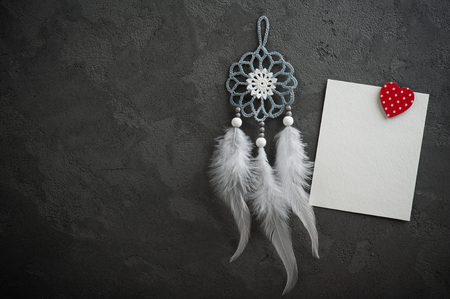 White empty card on concrete wall with christmas decorations. Space for greeting text.の写真素材
