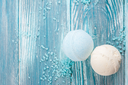 SPA still life, closeup of blue bath bombs on wooden background. Flat lay with space for textの写真素材