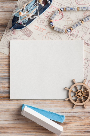 Mock-up, empty paper note, boat and stamps view from above. Vacation theme.の写真素材