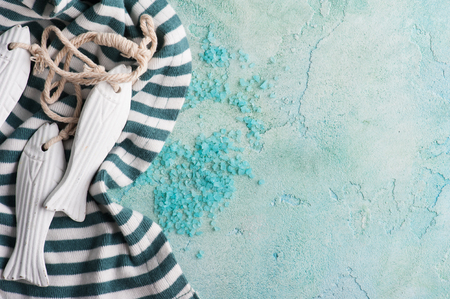 SPA composition with salt and wooden decoration on blue concrete background の写真素材