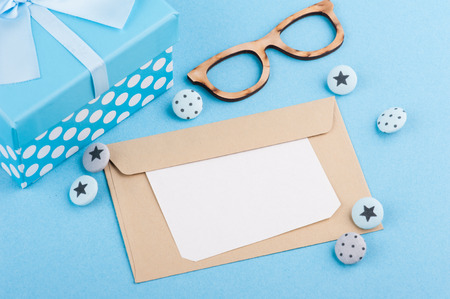 Blue decor, buttons, stationery. Blank card with space for text. Top viewの写真素材