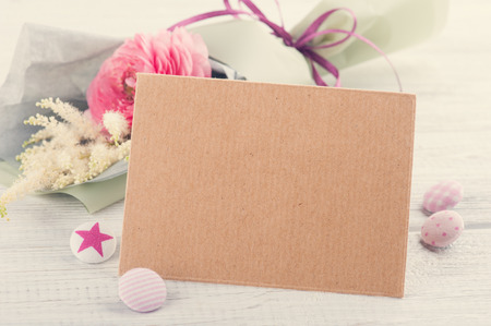 Craft envelope with bouquet and pink buttonsの写真素材