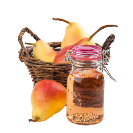 Homemade pear cider in basket isolated on a white backgroundの写真素材