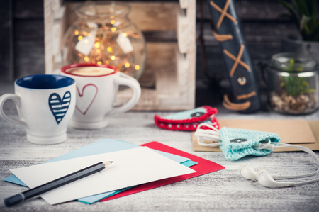 Set of colorful greeting envelopes in lifestyle interior with lights on background. Christmas or St. Valentines designの写真素材