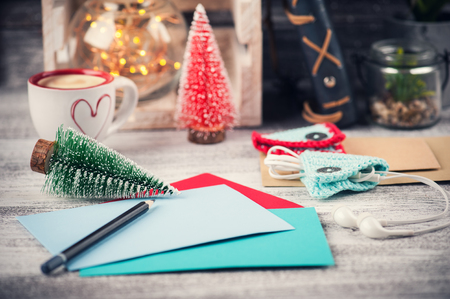 Set of colorful greeting envelopes in lifestyle interior with Christmas decorationsの写真素材