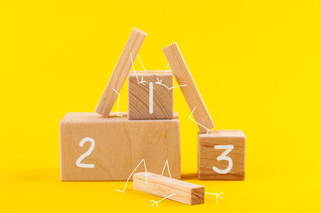 Wooden podium with white numbers on yellow background. Winner defeated
