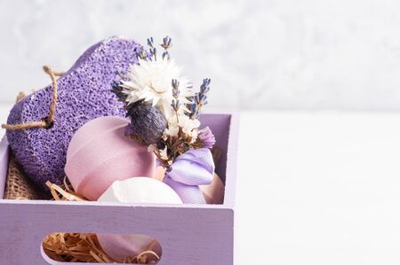 Aroma bath bombs, purple pumice and lavender in SPA arrengement in wooden box . Ccopy space for textの写真素材