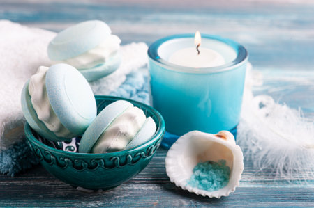 Spa composition with bath bomb macaroon and dry flowers on rustic background. Essential oil and salt. Beauty treatment and relaxの写真素材