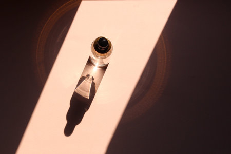 A cosmetic or medical glass bottle with a serum or oil dropper. Skin care concept. Natural hard...
