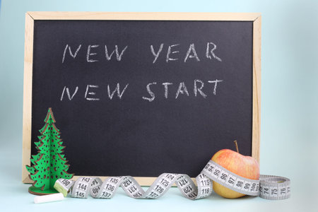 New year, new start lettering on the blackboard with chalk. Motivational quote for New Year 2021...