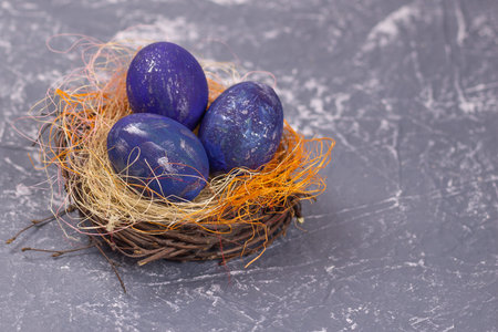 space easter eggs on gray background. Selective focus. Copy space