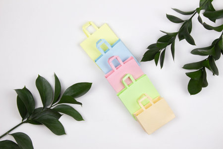 Colorful paper bags on the table. The concept of shopping