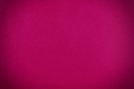 Red burgundy paper texture background. Crimson grunge wall background with dark spots.の写真素材