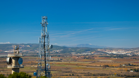 Landscape of mountains and valleys with radio towers.の写真素材