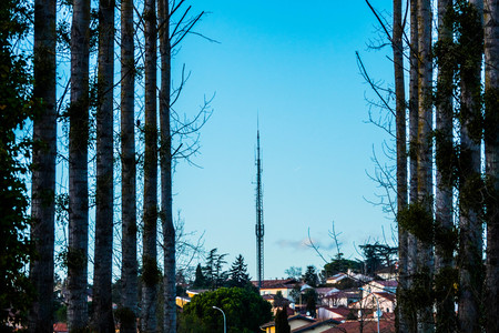 Radio tower in the village among the forest to avoid computer isolation. .の写真素材