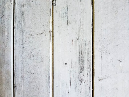 Background of wooden boards covered with white peeling paintの写真素材