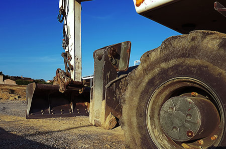 The industrial landscape of the construction site with details of the heavy earthmover construction...