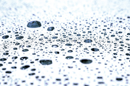 Rain drops on glass horizontal surface. macro background. Focus selective.の写真素材