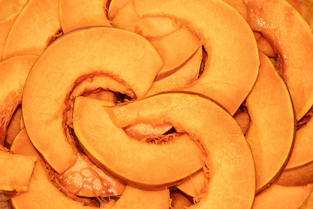 orange texture from slices of pumpkin top viewの写真素材