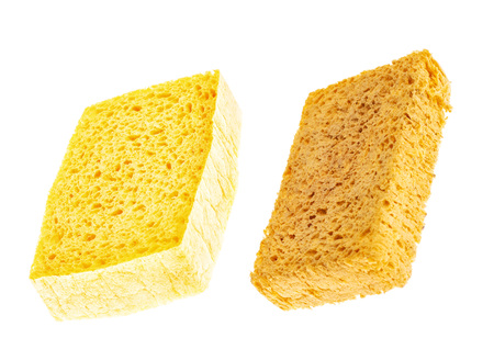 New yellow and used old sponge isolated on white background. The concept of hygiene and cleanliness.の写真素材