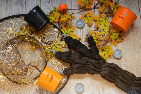 Halloween party female outfit accessories: glove, hat with pumpkin decor and candles. Flat lay, top viewの写真素材