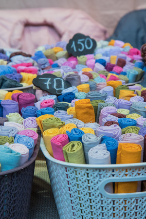 Traditional fabric store with stacks of colorful textiles, fabric rolls at market stall - textile industry background with blurred. Fabric Store, Traditionalの写真素材