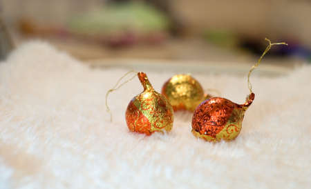 The New year red-yellow small balls on the furの写真素材