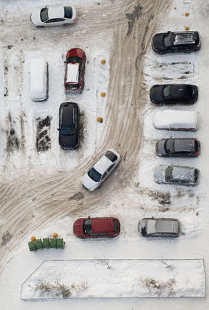The dirty winter parking near the houseの写真素材
