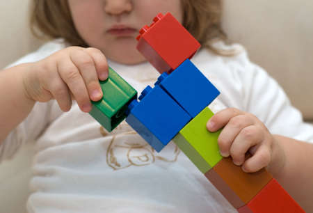 Baby play of multicolored building kit, the pyramid of the bricksの写真素材