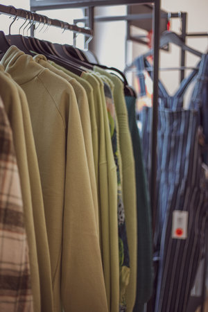 Clothing on hanger at the modern shop boutique.