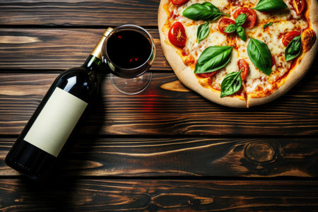 Pizza and wine bottle on wood.の素材