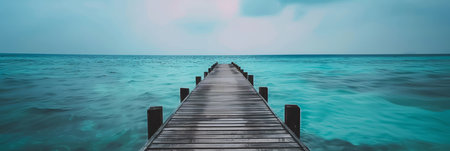 Wooden dock above bright blue waters.の素材
