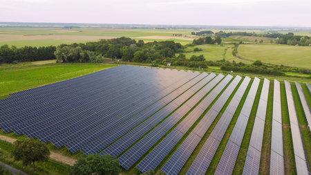 Aerial view of solar power plant in rural landscape.