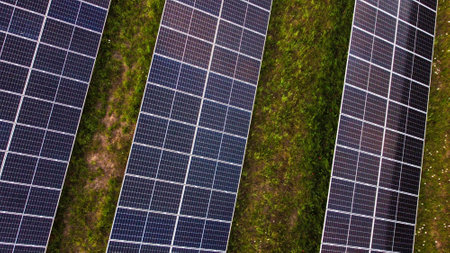 Close-up of solar panels on a green field.の写真素材