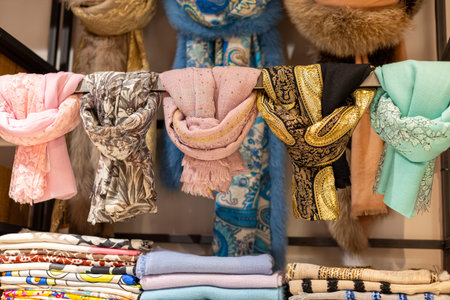 Colorful scarves displayed in a boutique highlighting diverse styles and textures