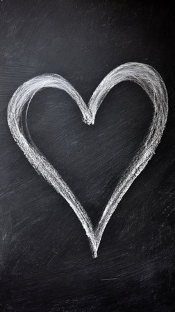 Chalk heart drawn on a blackboard in a creative classroom setting highlighting art and expressionの素材