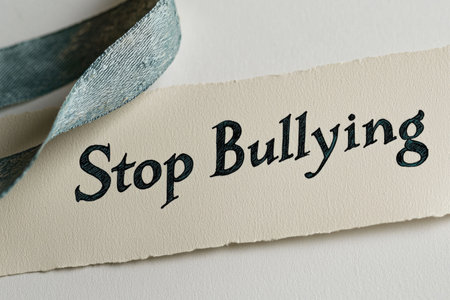 Anti bullying action: text stop bullying, call to end harmful behavior, promote kindness and respect, importance of standing up against intimidation and fostering a safe, supportive environment.の素材