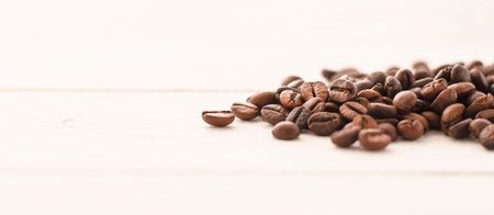 roasted coffee beans on a wooden white table