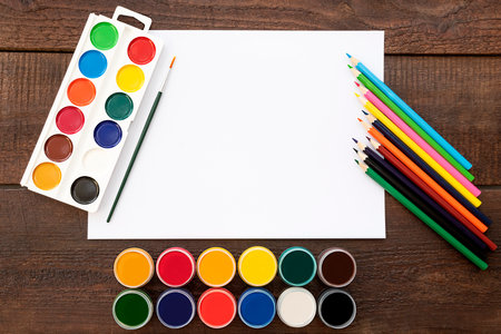 painting supplies on a wooden tableの写真素材