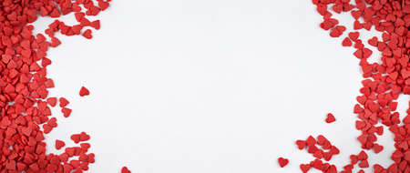 background for valentine's day with small hearts and copy spaceの写真素材