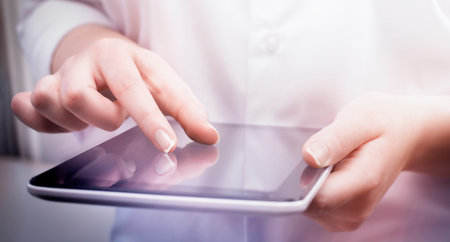 business woman working on digital tablet