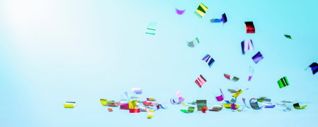 falling multicolored confetti on a light blue background. holiday background