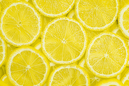 fresh lemon sliced into slices. lemon background